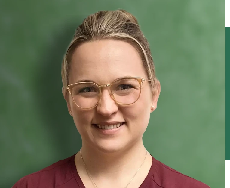 A woman with glasses with green background